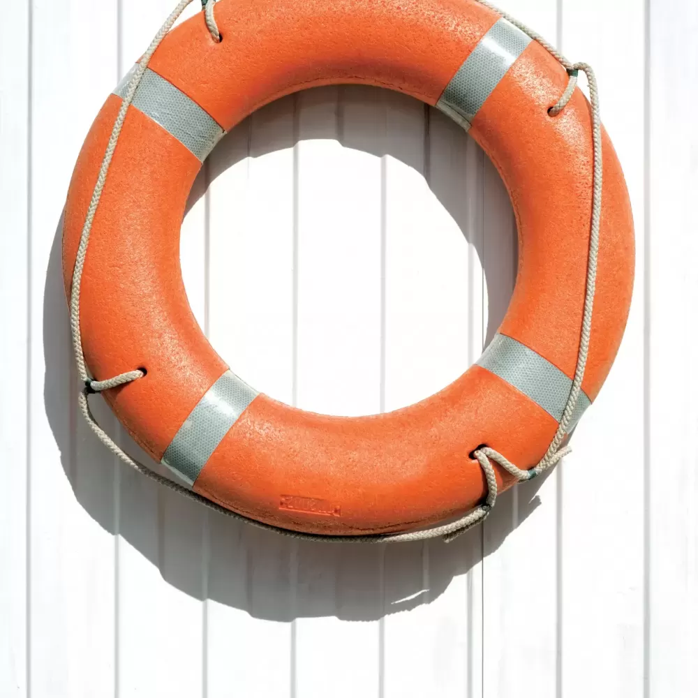 orange-lifebuoy-on-fence-2021-08-26-16-52-34-utc